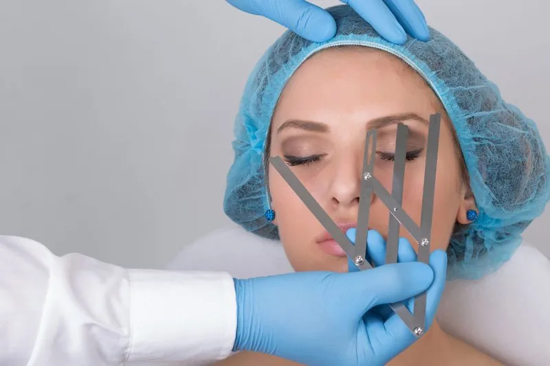 Brow mapping marks drawn before a cosmetic tattoo appointment